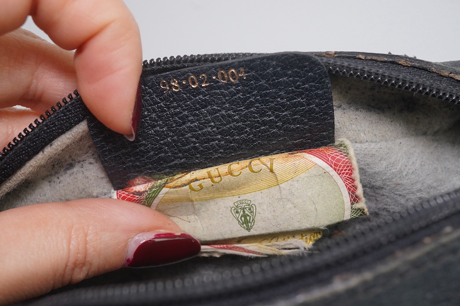 Three vintage Gucci handbags, two canvas blue GG monogram and the other black leather